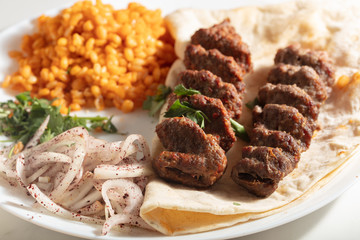 Turkish Adana Kebab with Vegetables on the Plate