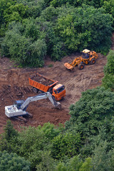 Start of construction in a green forest, top view