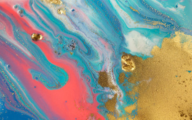 Marbled blue and pink abstract background with golden glitter.