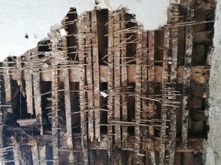 old ruined laths on broken ceiling roof of a abandoned house