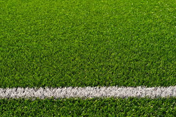 Soccer field texture close up. Grass in the stadium. Finely mown lawn for sports grounds. Straight...