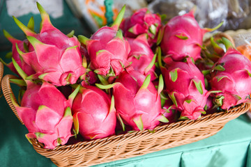 Obraz na płótnie Canvas Dragon fruit in the basket for sale in the fruit market - Fresh Pitaya