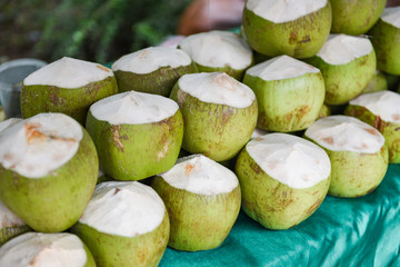 Fresh young coconut for juice drink on wooden table background /