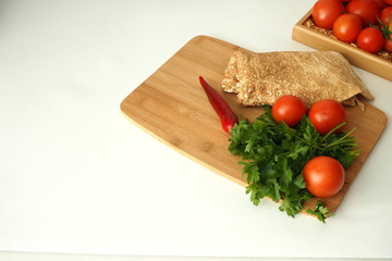 Thin Armenian pita bread with tomatoes greens and spices. ingredients for homemade vegetarian falafel.