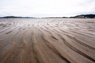 Waves texture small sand banks.