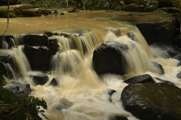 Man Fah waterfall after heavy rainfall in deep forest at Thap Lan National Park, Thailand.