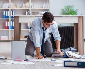 Bankrupt businessman angry in the office floor
