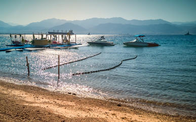 Floating island, pier, boats with relaxing and resting facilities, image depicts pleasure traveling and bliss vacation atmosphere along beaches of the Red Sea and Acaba gulf