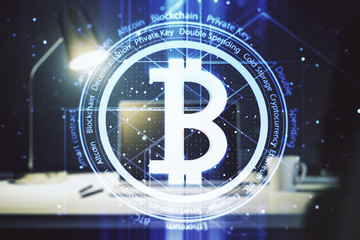Double exposure of creative Bitcoin symbol hologram with computer on background. Mining and blockchain concept