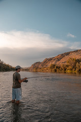 Fototapeta na wymiar river fisherman with fishing rod