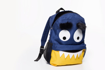 School during Covid19 pandemic, monster face backpack on white background, virus face