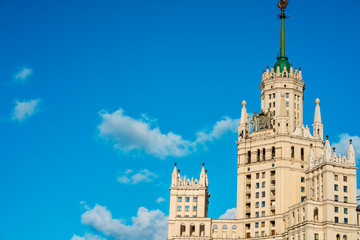Fototapeta na wymiar Moscow / Russia - 15 Aug 2020: Panorama of the famous high-rise building in Moscow against the blue sky in Kotelnicheskaya embankment, river walks and tourist season