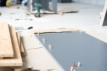 Assembling furniture installation of shelves with new apartment a shelf new home construction of interior room © Angelov