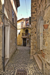 A small street between the old houses of Giuliano di Roma, of a medieval village in the Lazio region, Italy.
