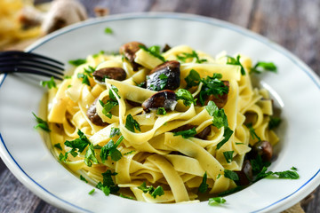  Home made  fresh italian tagliatelle pasta with mushrooms and fresh  parsley