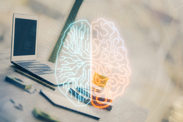 Double exposure of desktop with computer and brain drawing hologram. Artificial intelligence concept.