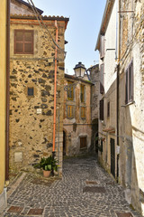 A small street between the old houses of Giuliano di Roma, of a medieval village in the Lazio region, Italy.
