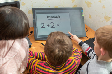 Cute children do homework at home.