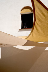 awnings for the sun and window on the facade