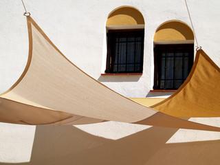 awnings for the sun and window on the facade