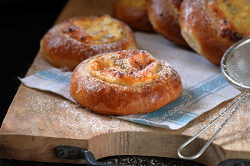 Russian Creamcheese Vatrushka Buns. Sweet buns with cottage cheese and raisins.