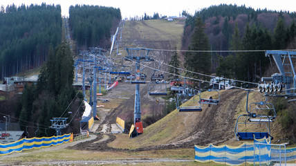 Ukraine, Bukovel - November 20, 2019. Autumn view of the ski resort with a chairlift against the...