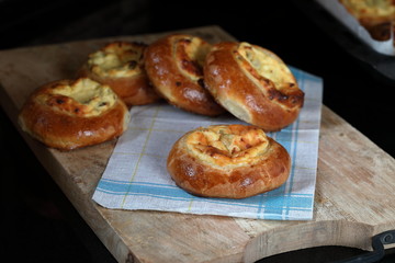 Russian Creamcheese Vatrushka Buns. Sweet buns with cottage cheese and raisins.