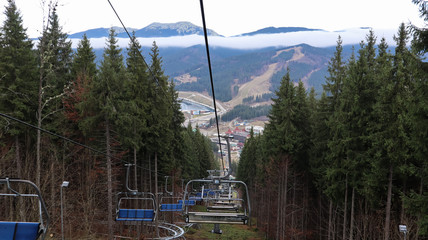 Ukraine, Bukovel - November 20, 2019. Autumn view of the ski resort with a chairlift against the...