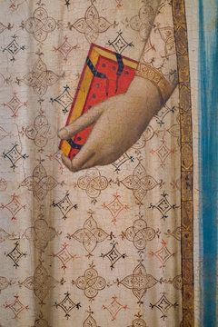 Hand and Book, detail from "The Madonna del Parto" crowned by the Angels, 1330-1335 circa, Tempera on panel by Bernardo Daddi (1290-1348). Uffizi Galleries, Florence, Italy