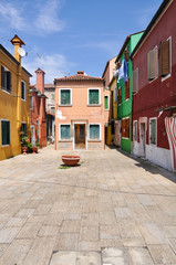 Fototapeta na wymiar One isolated dominant house in Burano island in Venice. 