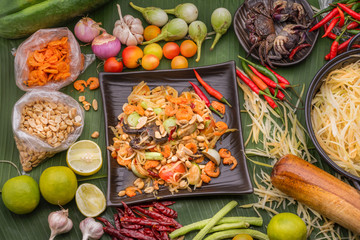 Thai papaya salad is street food It is a favorite food for both Thais and foreigners With seasoning roasted nuts lime papaya chili pickled crab fermented fish garlic dried shrimp top view.
