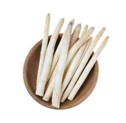 Fresh ripe asparagus in bowl isolated on white, top view