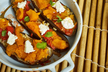 Baked aubergine stuffed with roast pumpkin, feta