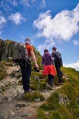 Family of hikers into the mountains