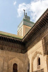 Fototapeta na wymiar Looking up at minaret from courtyard of R'cif Mosque, Fes, Morocco