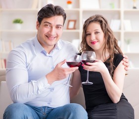 Young pair drinking wine in romantic concept