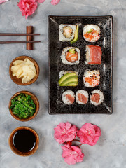 Sushi Set nigiri and sushi rolls on rectangular plates