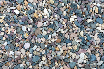Different size and color stone background. Outdoor background design. Gravel path background . Close up