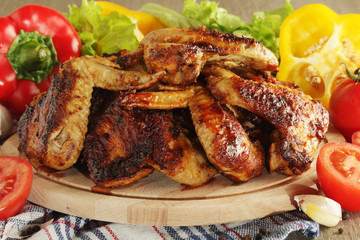 Chicken wings barbecue with different vegetables	
