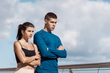 Man and woman making sport training outdoors together