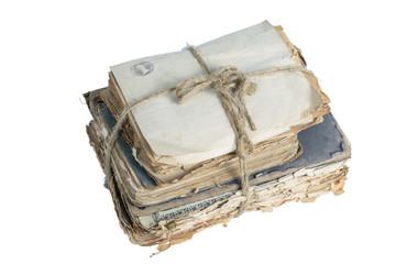 Old books and papers tied with a rope isolated on a white background