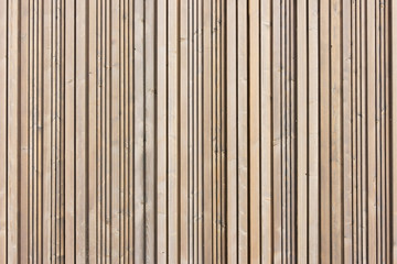 Brown wood wall. Wooden desk background. Straight lines wooden panels. Natural rustic hardwood board texture.