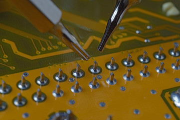 Inspection and repair of contacts on the motherboard microcircuit. macro.