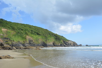 Pretty calm sea coastline ocean cliff view in Cornwall England
