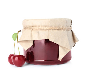 Jar of cherry jam and fresh berries on white background