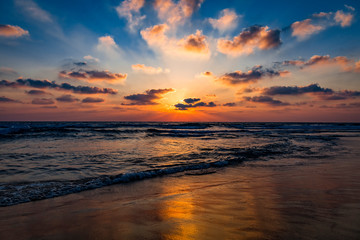 Obraz na płótnie Canvas Beautiful amazing sunset or sunrise over the sea or ocean. Rays of the sun through the clouds. Dramatic sky.