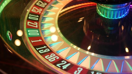 French style roulette table for money playing in Las Vegas, USA. Spinning wheel with black and red...
