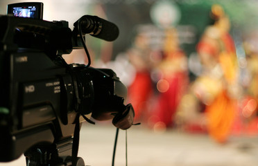 Close-up view of video camera on tripod