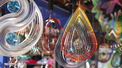 Colorful geometric metallic wind spinner, garden hypnotic surreal decoration, California USA. 3D...