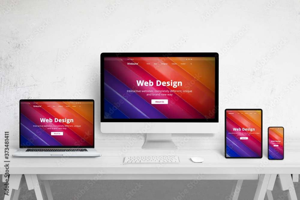 Aufkleber Responsive web site design on different devices. Web design studio desk with laptop, computer display, tablet and mobile phone